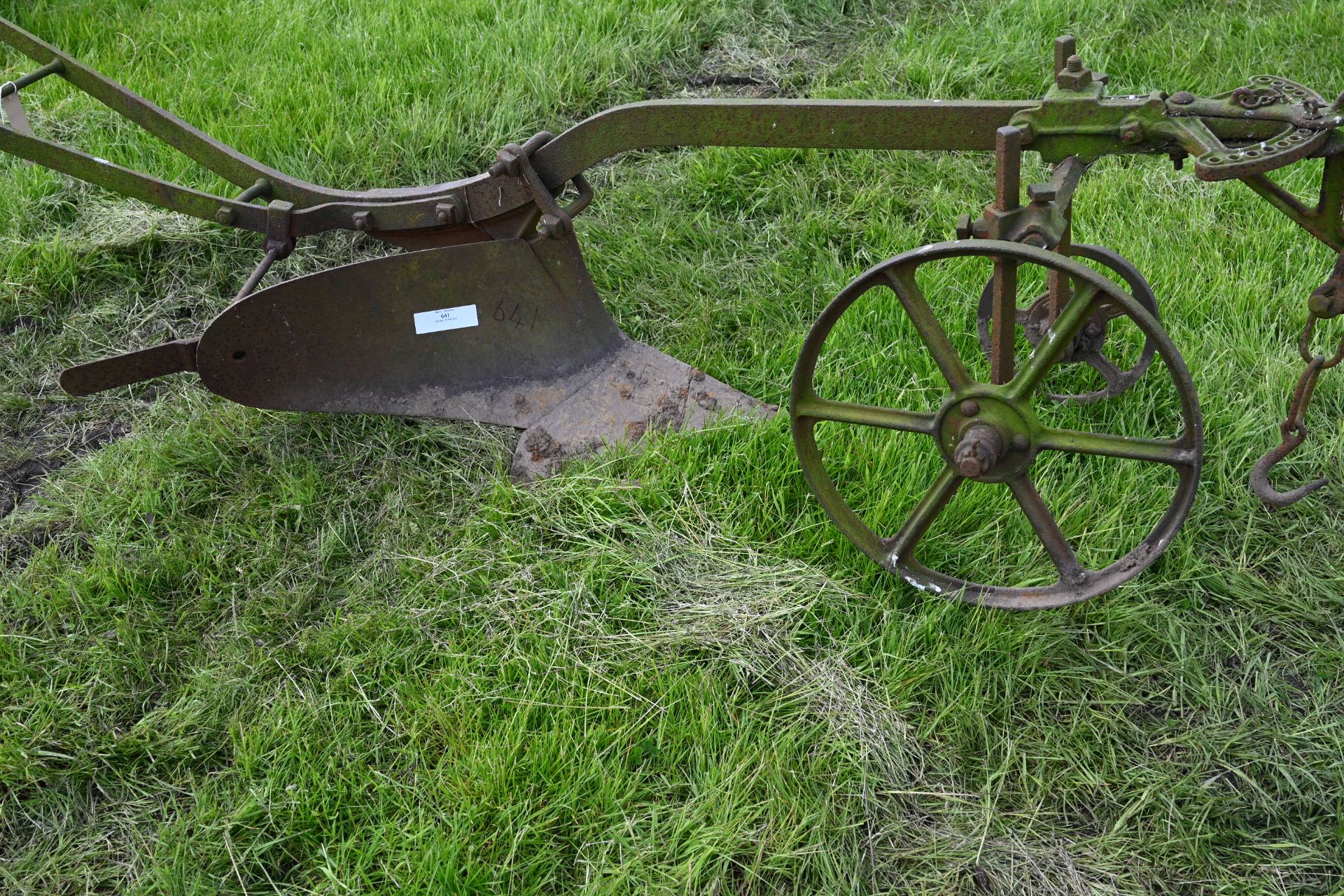 One single furrow horse drawn plough with wheels and guide handles