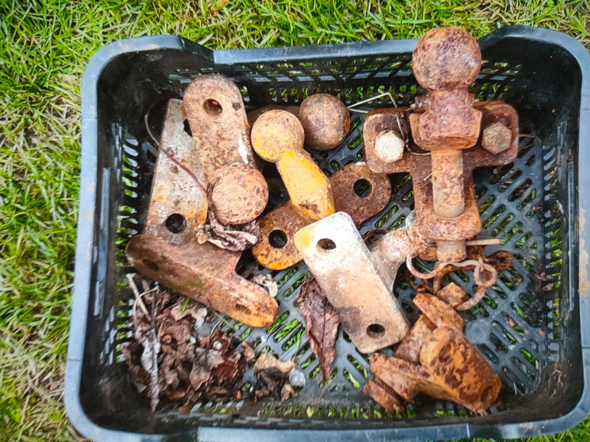 box of various trailer tow balls