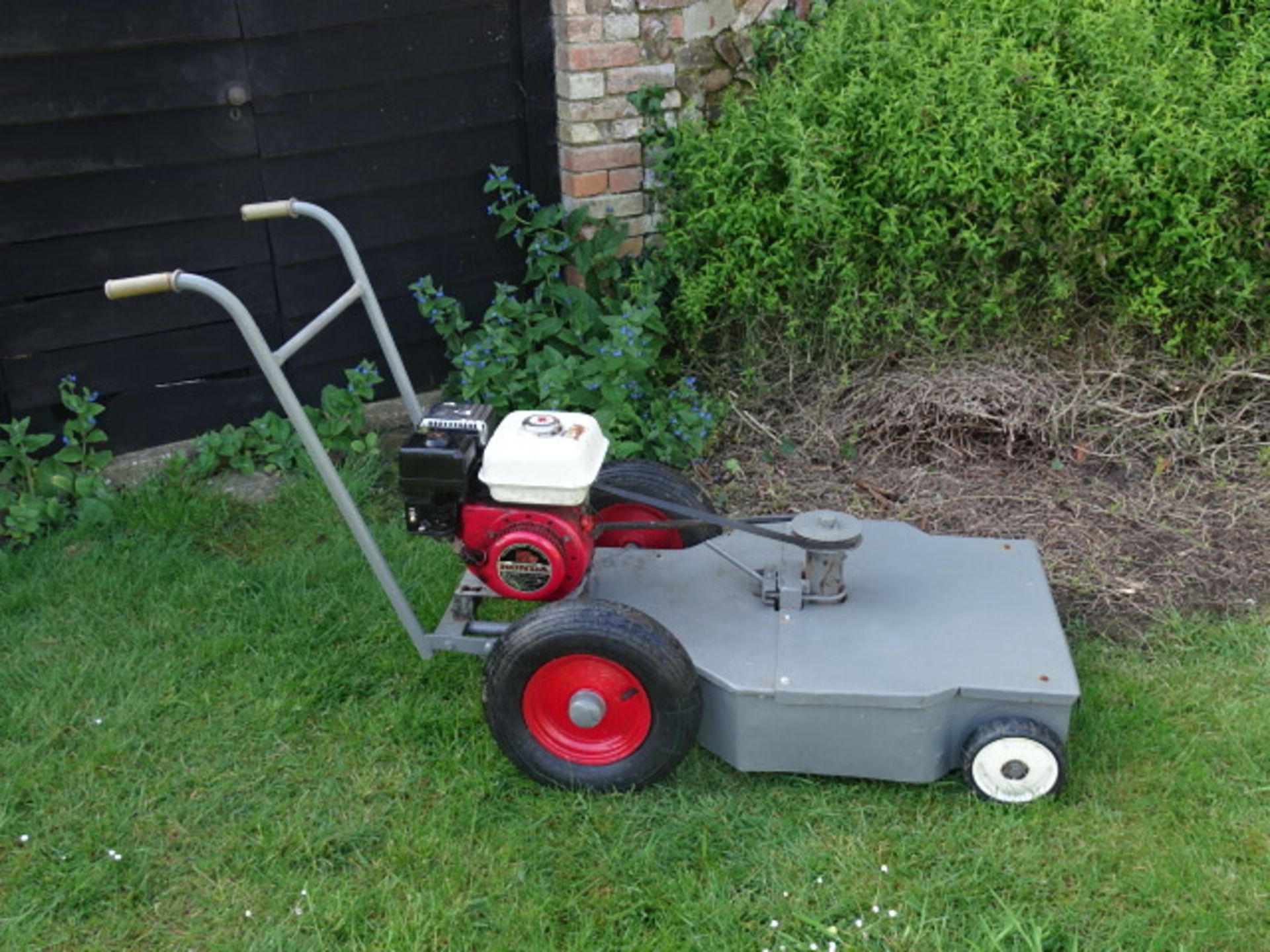 Walk behind flail mower with Honda engine