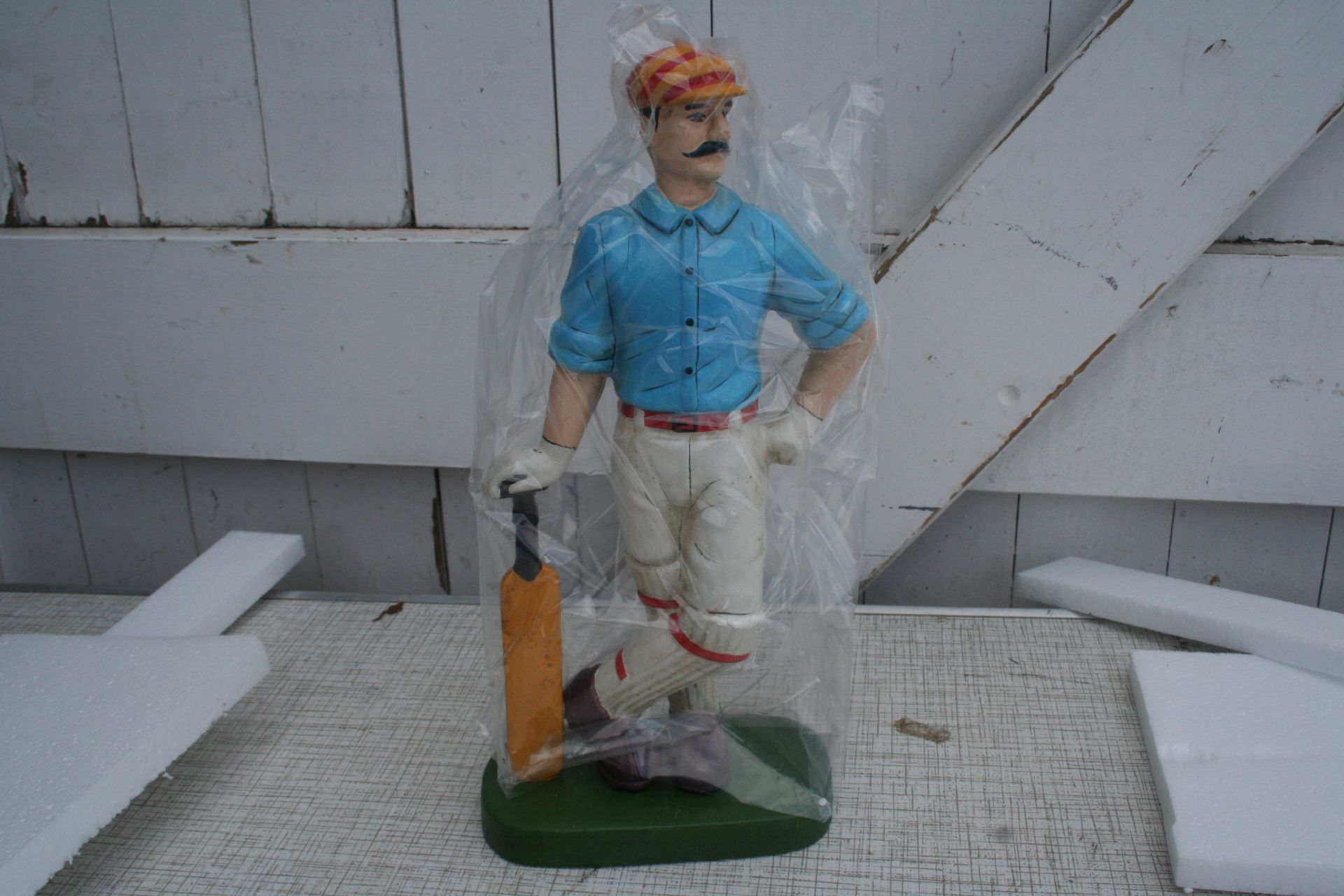 Cricketer doorstop