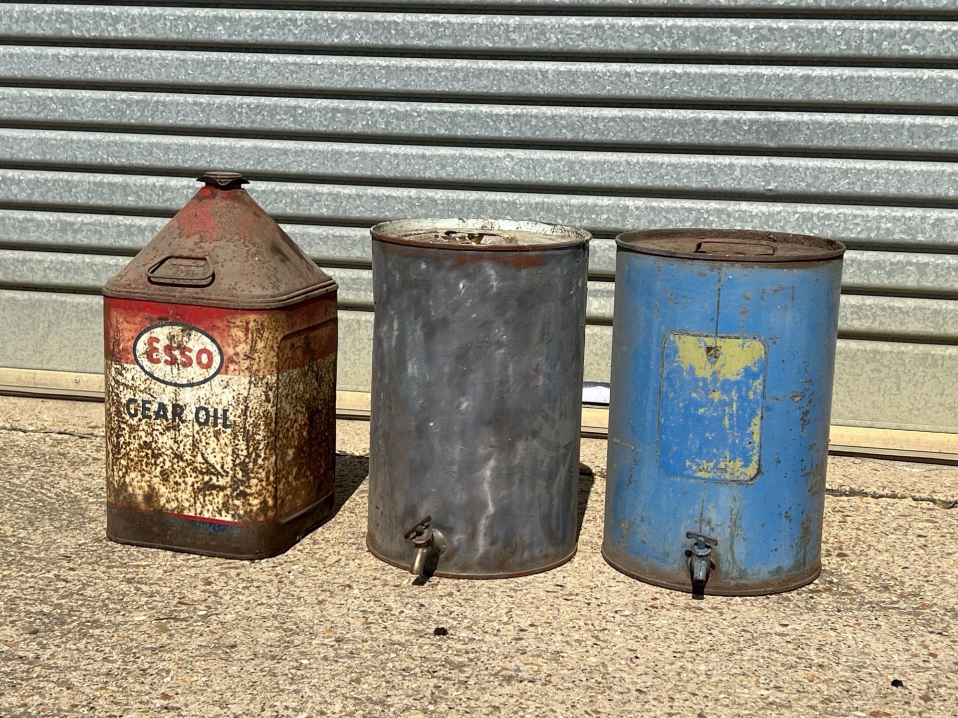 Three vintage 5 gallon oil drums