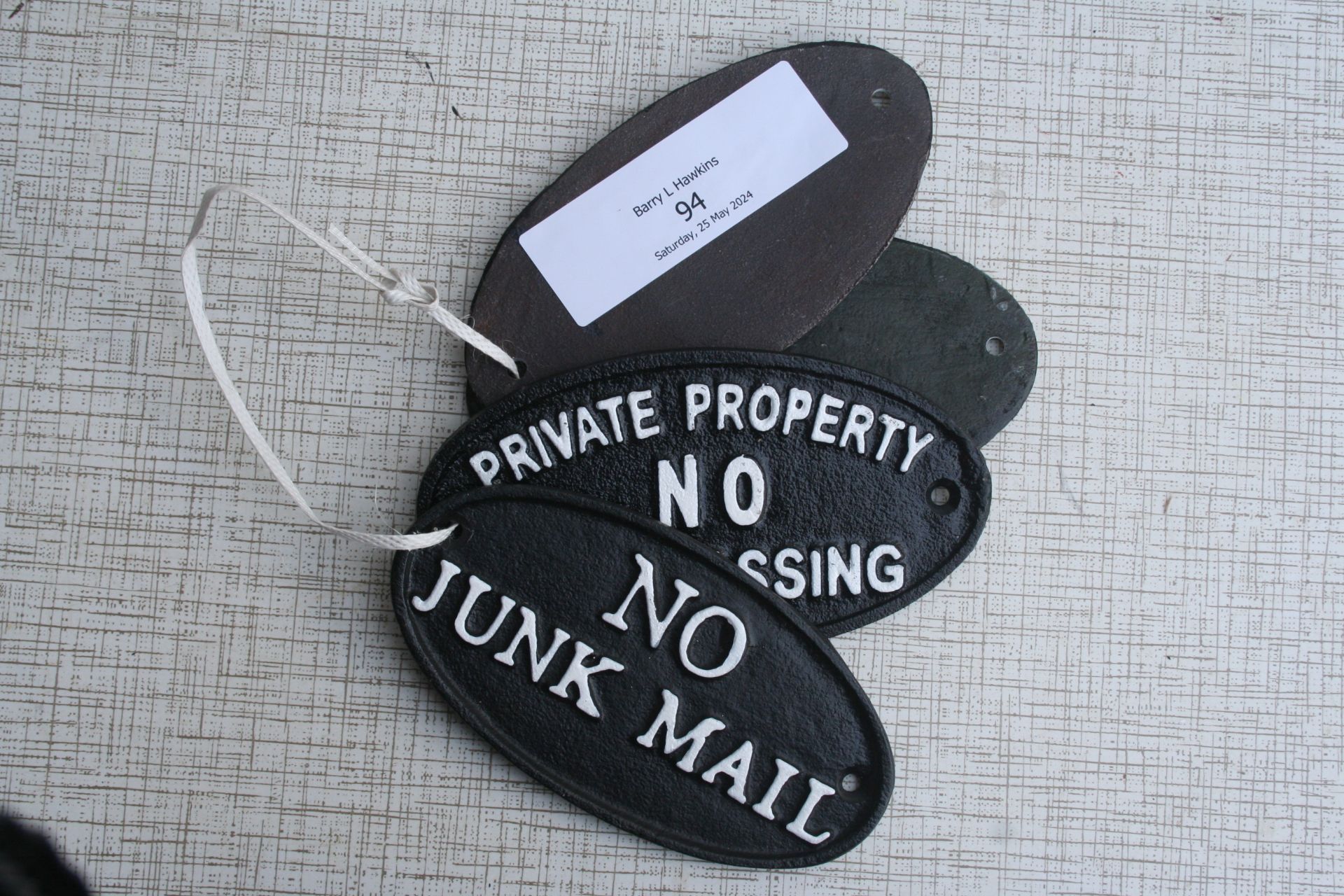 4 oval cast iron signs