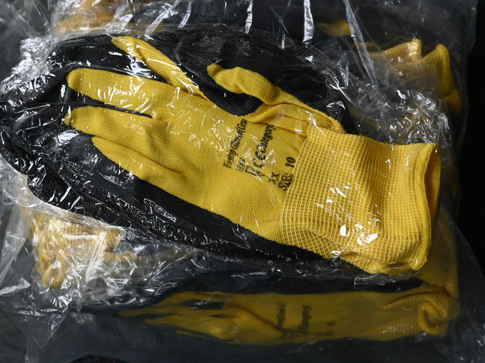 12 pairs of yellow and black nitrile coated gloves