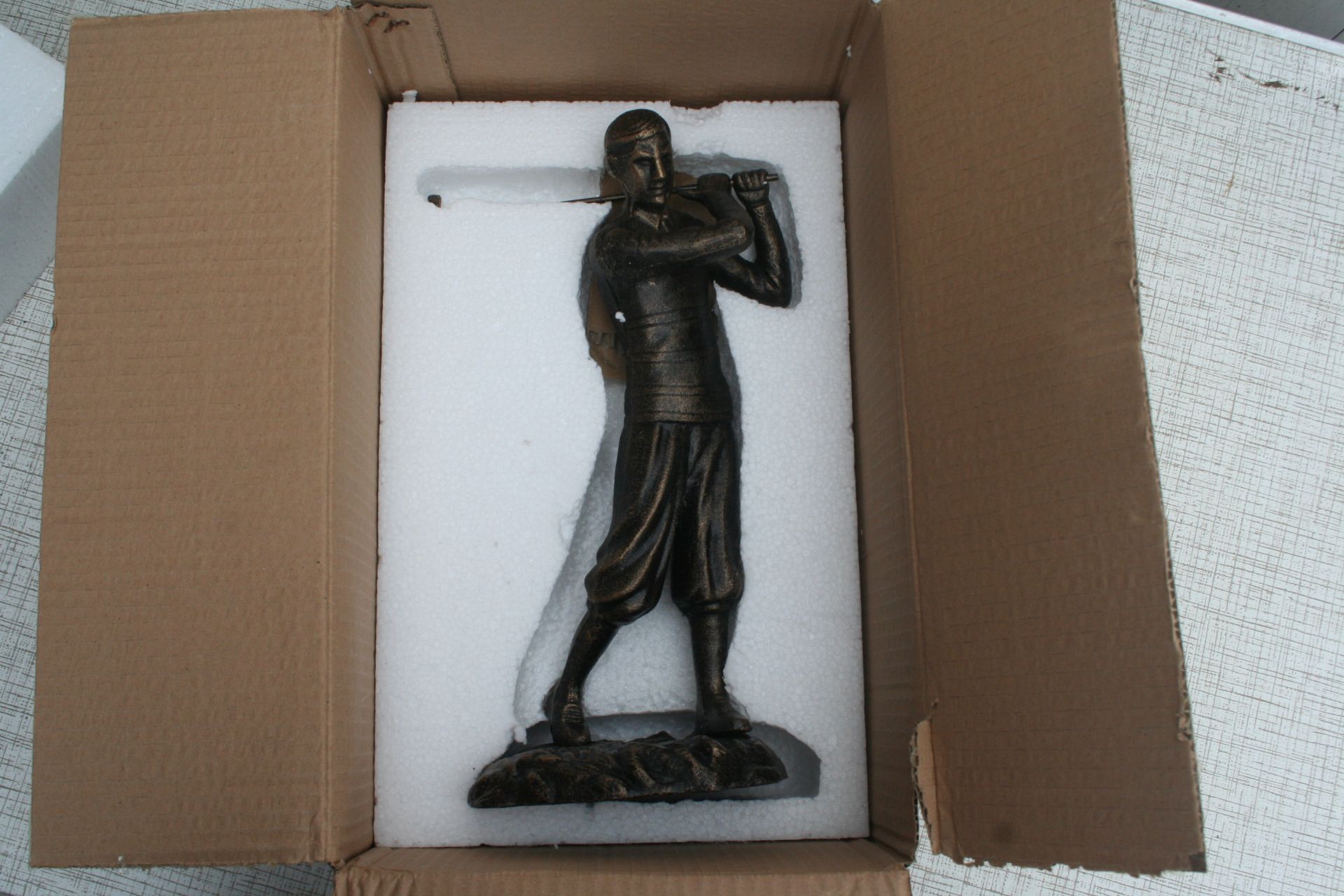 Bronze finish golfer figure