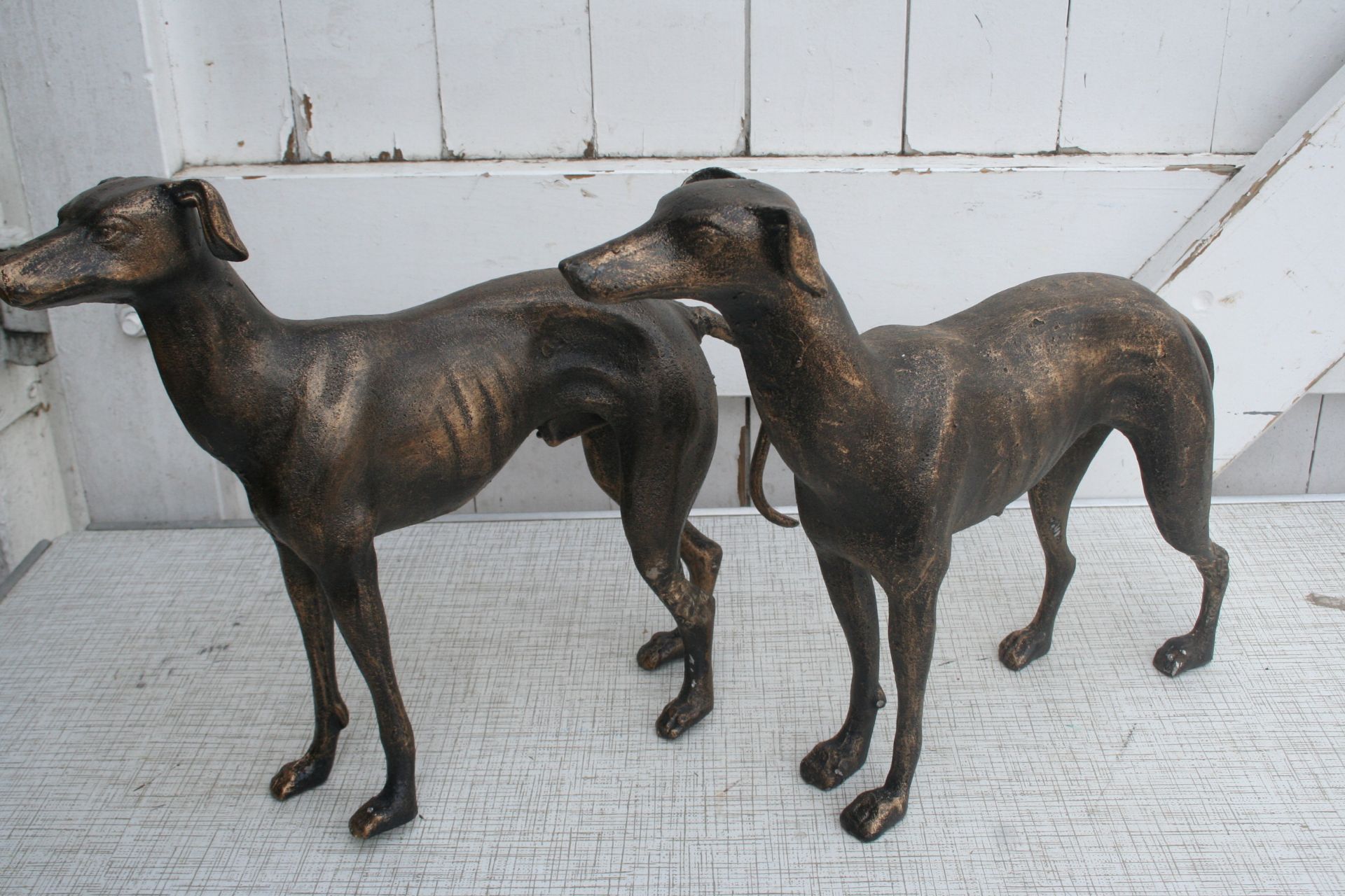 Pair of cast greyhound figures