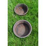 Two cast iron feed bowls