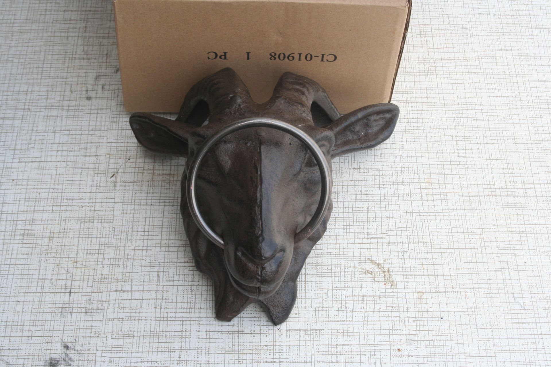 Goat head with ring