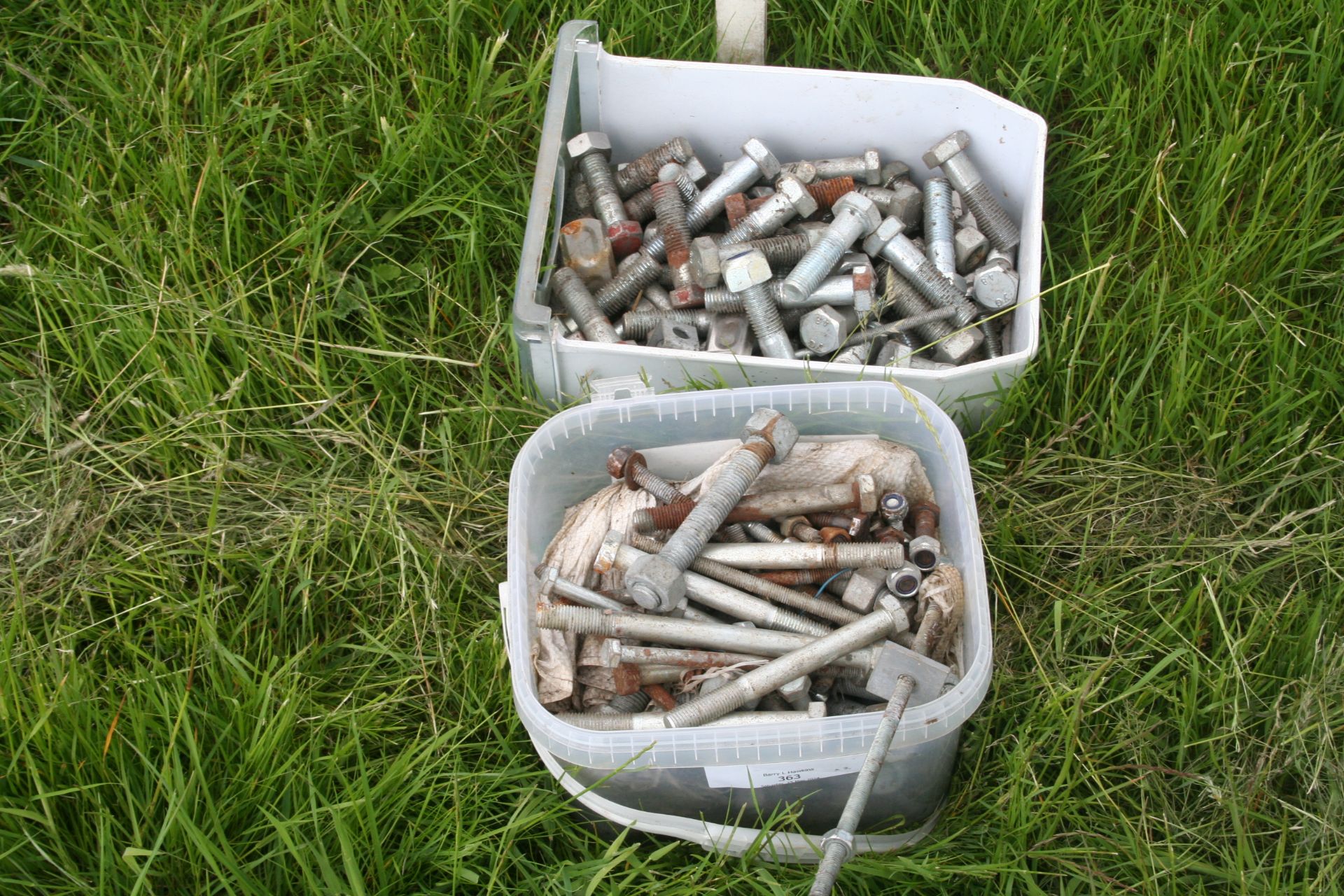 two boxes of bolts