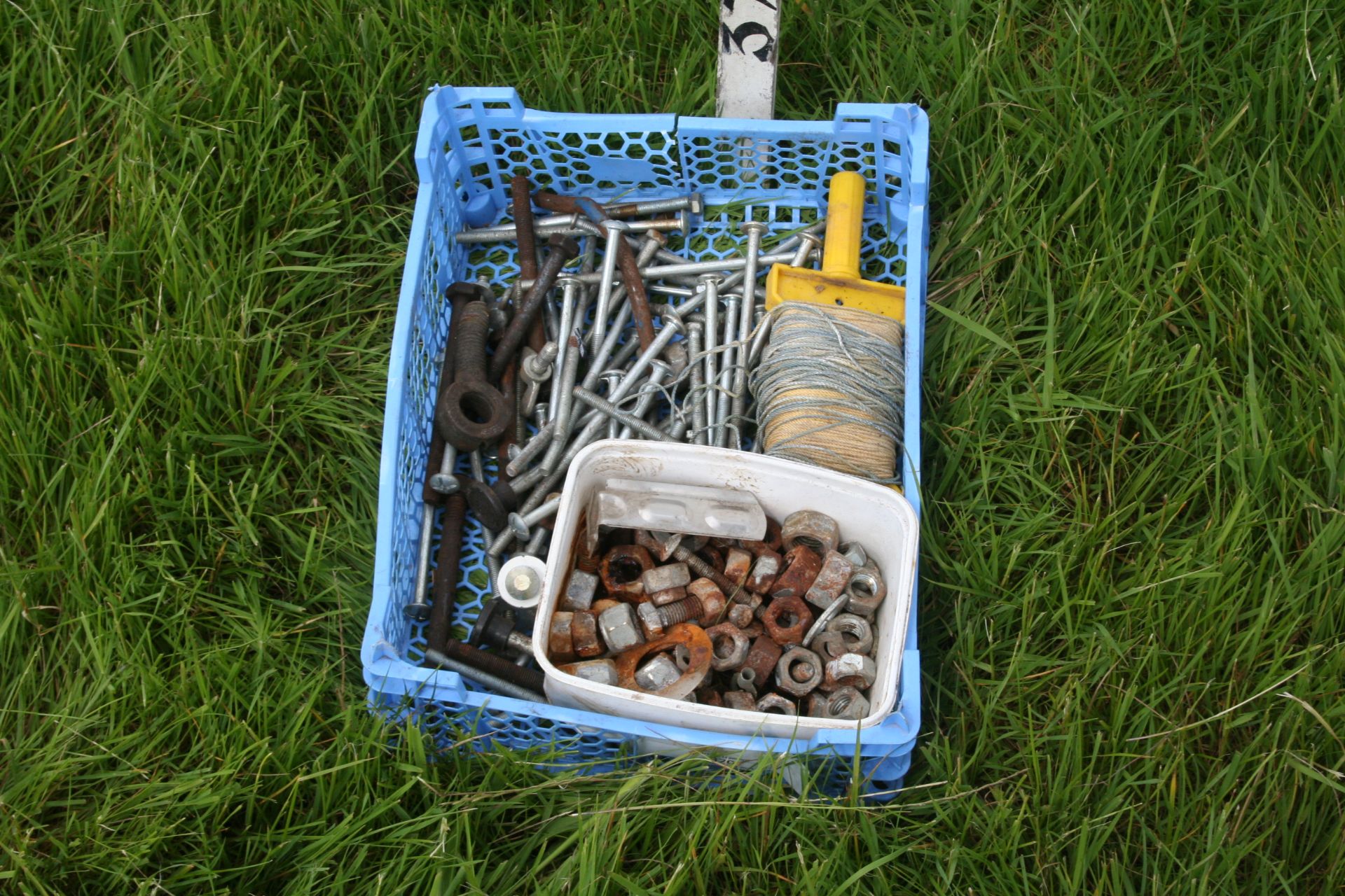 blue tub of nuts and bolts