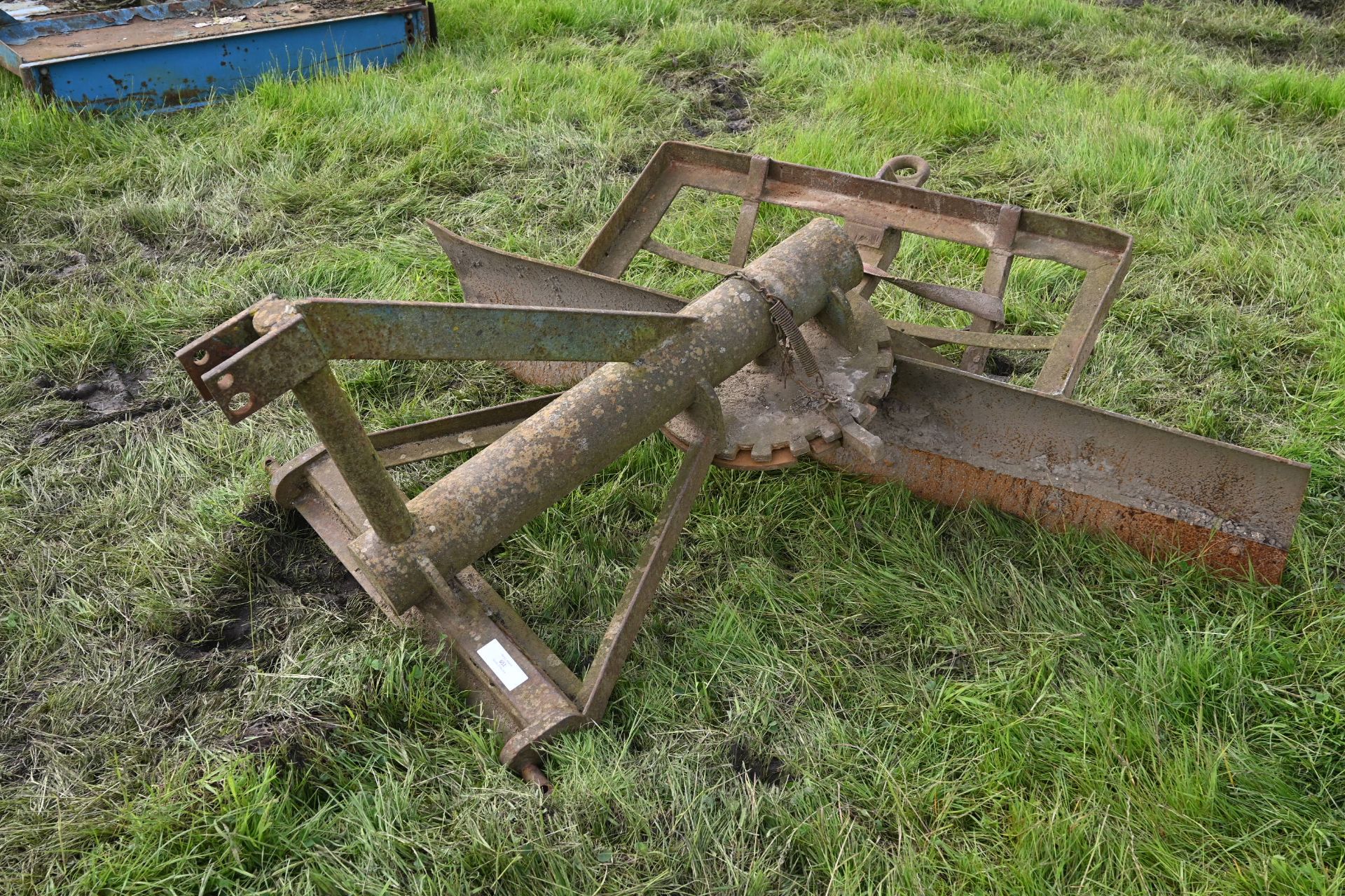 Tractor mounted road scraper