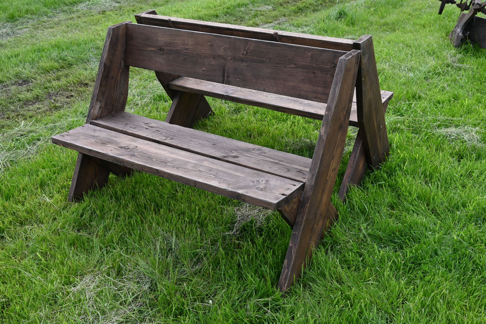 Pair of wooden garden benches constructed of ex-scaffold boards