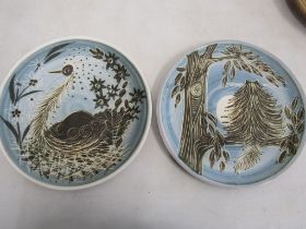 Hand painted plates of a bird and a cat