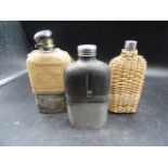 3 hip flasks, 2 with raffia casing and one with leather half case