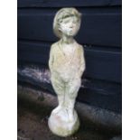 A whistling boy garden statue