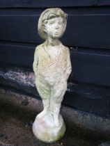 A whistling boy garden statue