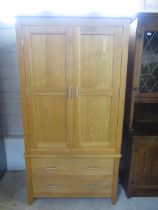 An oak wardrobe with 2 drawers (comes in 2 parts)