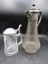 A stein with etched stag scene and a claret jug with etched detail