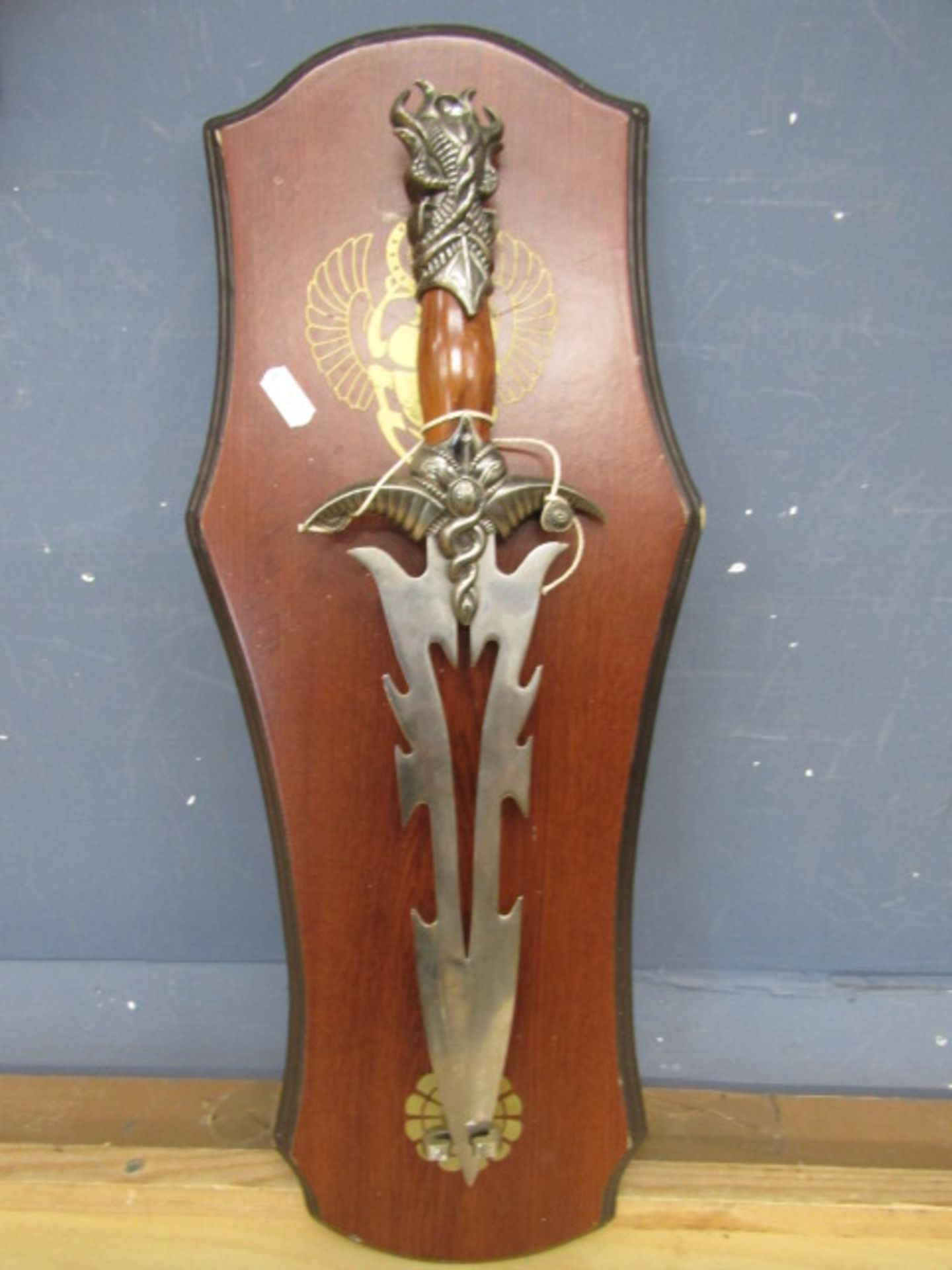 Ceremonial dagger on display board