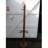 An oak arts and craft coat and stick stand with trays
