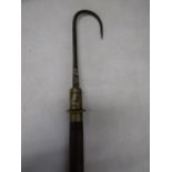 An antique Salmon Gaff - bamboo cane and extends