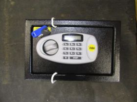 A Yale safe with key, code and instructions.