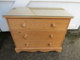 A pine chest of drawers 85x40cm 70cmH with glass top