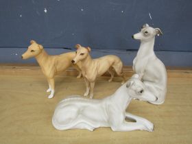 4 Greyhound figurines. Tallest 19cm approx
