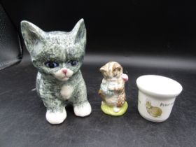 A ceramic cat, Beswick 'Miss Moppet' and a Wedgwood Peter Rabbit egg cup (tiny chip)