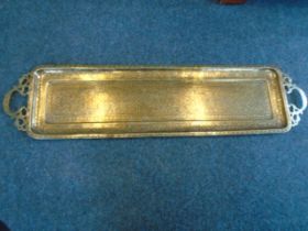 A Persian/middle eastern brass coffee tray 90cm at longest point.
