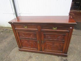 Mahogany dresser base with carved detail to doors and brass handles  H92cm W138cm D49cm approx