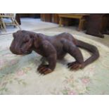 A large carved wooden Komodo Dragon 117cmL 80cm at widest point and 45cm at highest point.