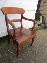 A vintage open arm chair