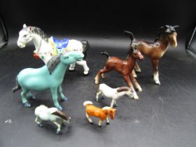 7 horse figurines inc one Beswick (larger brown)