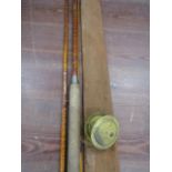 A vintage cane rod with vintage brass reel