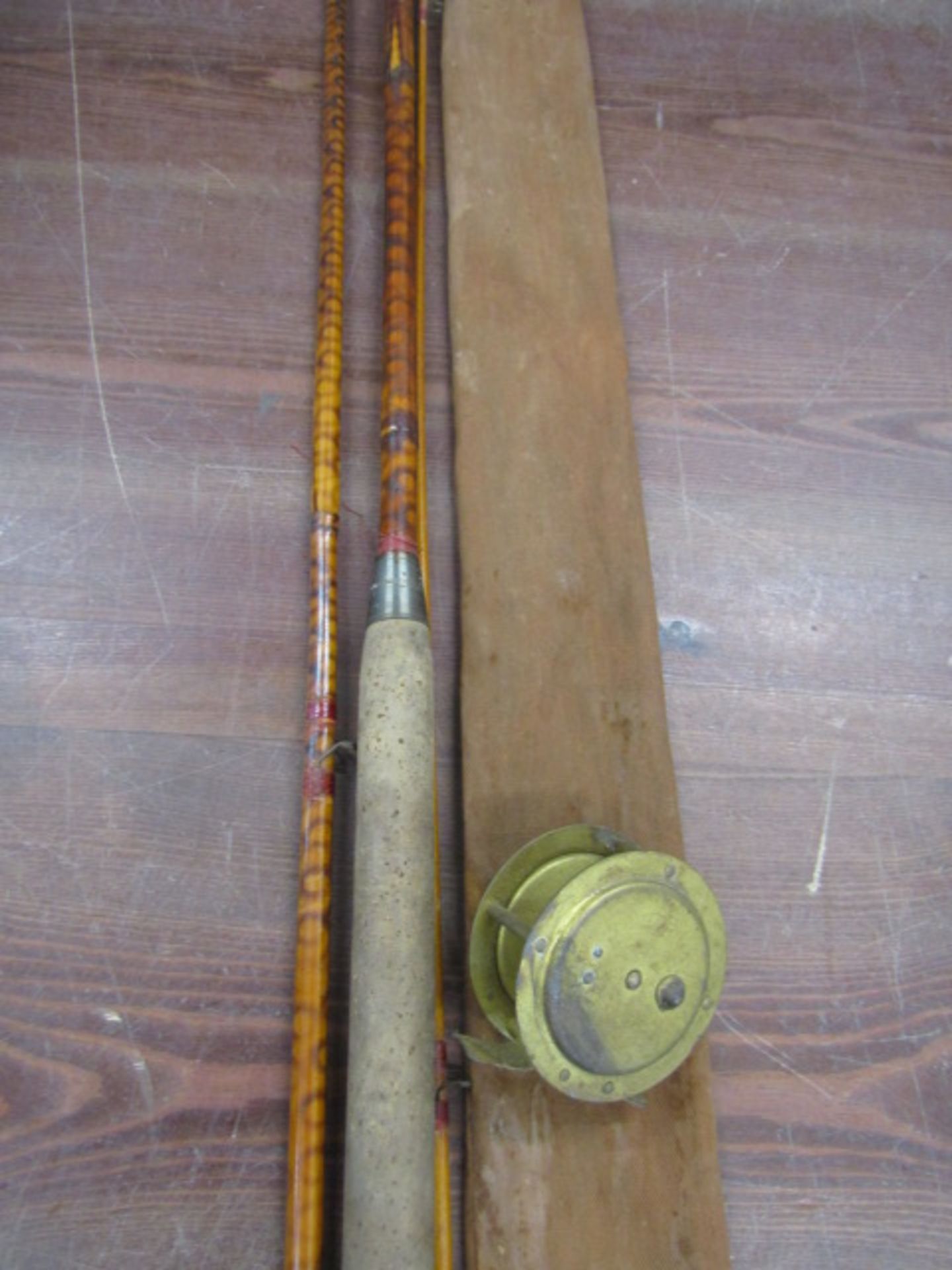 A vintage cane rod with vintage brass reel