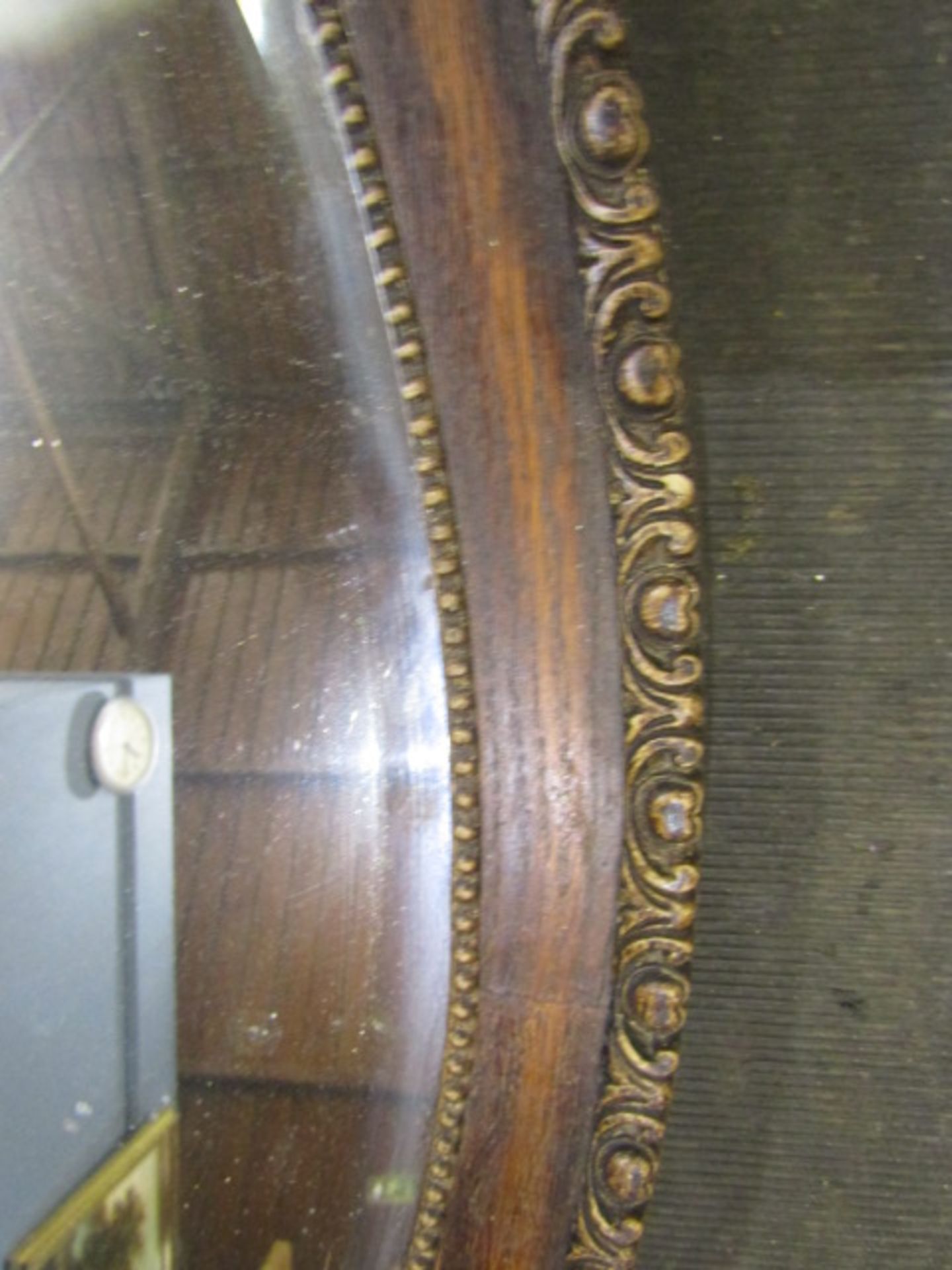 A oval carved framed bevelled mirror - Image 2 of 2