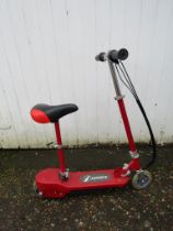 Electric scooter with charger from a house clearance