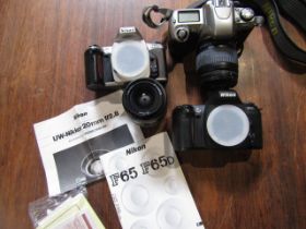 Nikon F65 camera, 2 F65 camera bodies, lens and booklets