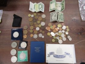 3 bank notes, commemorative crowns and mixed British and Foreign coinage along with a