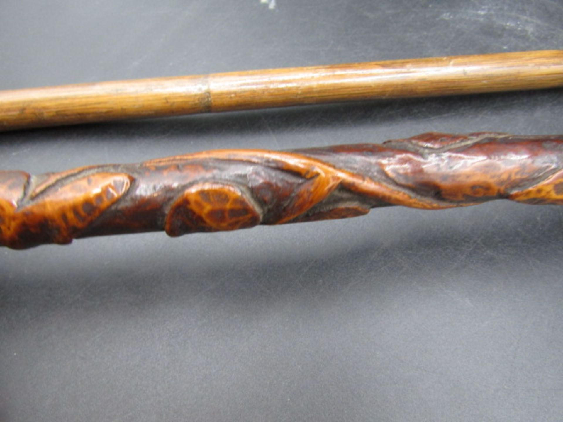 A carved walking cane with a hand clasping a ball with carved ivy down the cane plus a silver tipped - Image 5 of 7