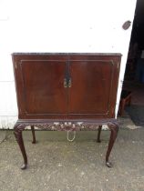 A vanity cabinet on cabriole legs