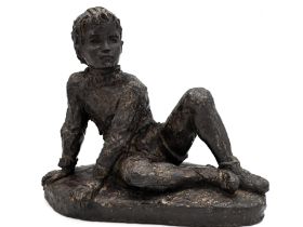 Karin Jonzen RBA FRBS, British 1914-1998 - Boy sitting; bronze resin, signed with initials on