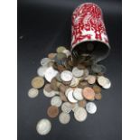 Mixed British and Foreign coins in a tin