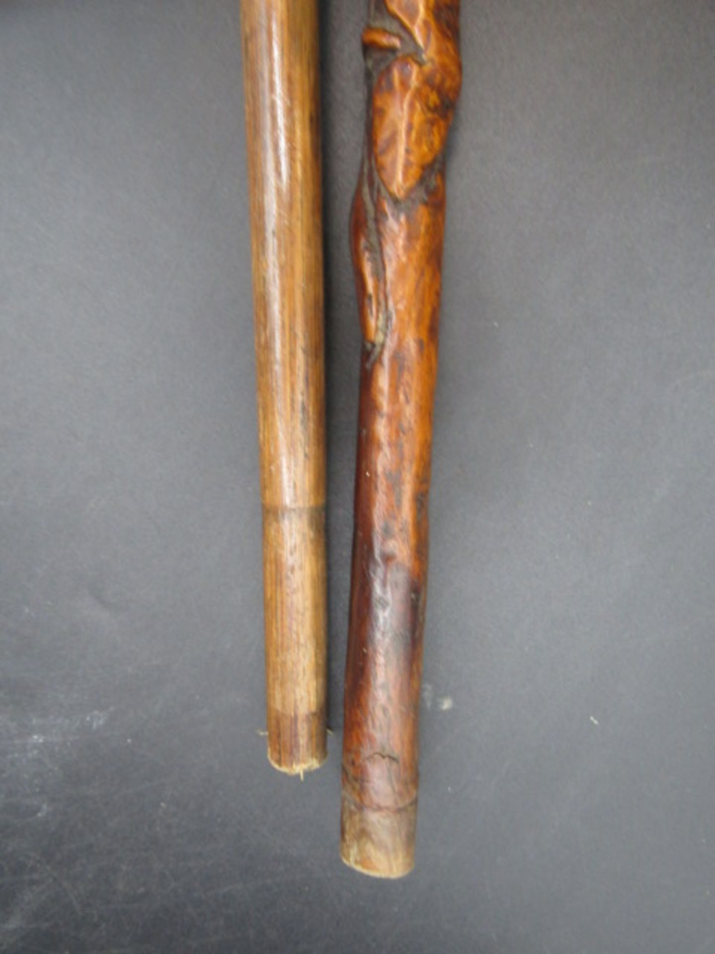 A carved walking cane with a hand clasping a ball with carved ivy down the cane plus a silver tipped - Image 7 of 7