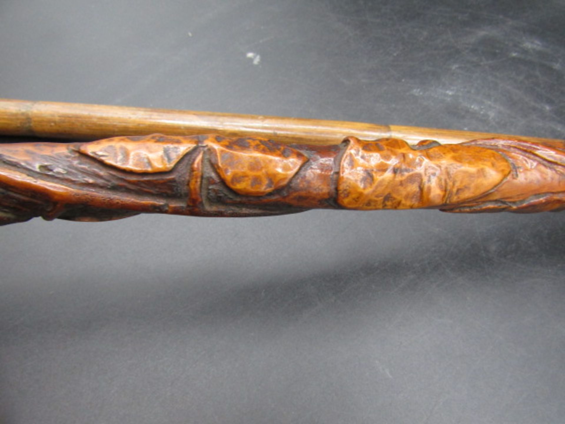A carved walking cane with a hand clasping a ball with carved ivy down the cane plus a silver tipped - Image 4 of 7