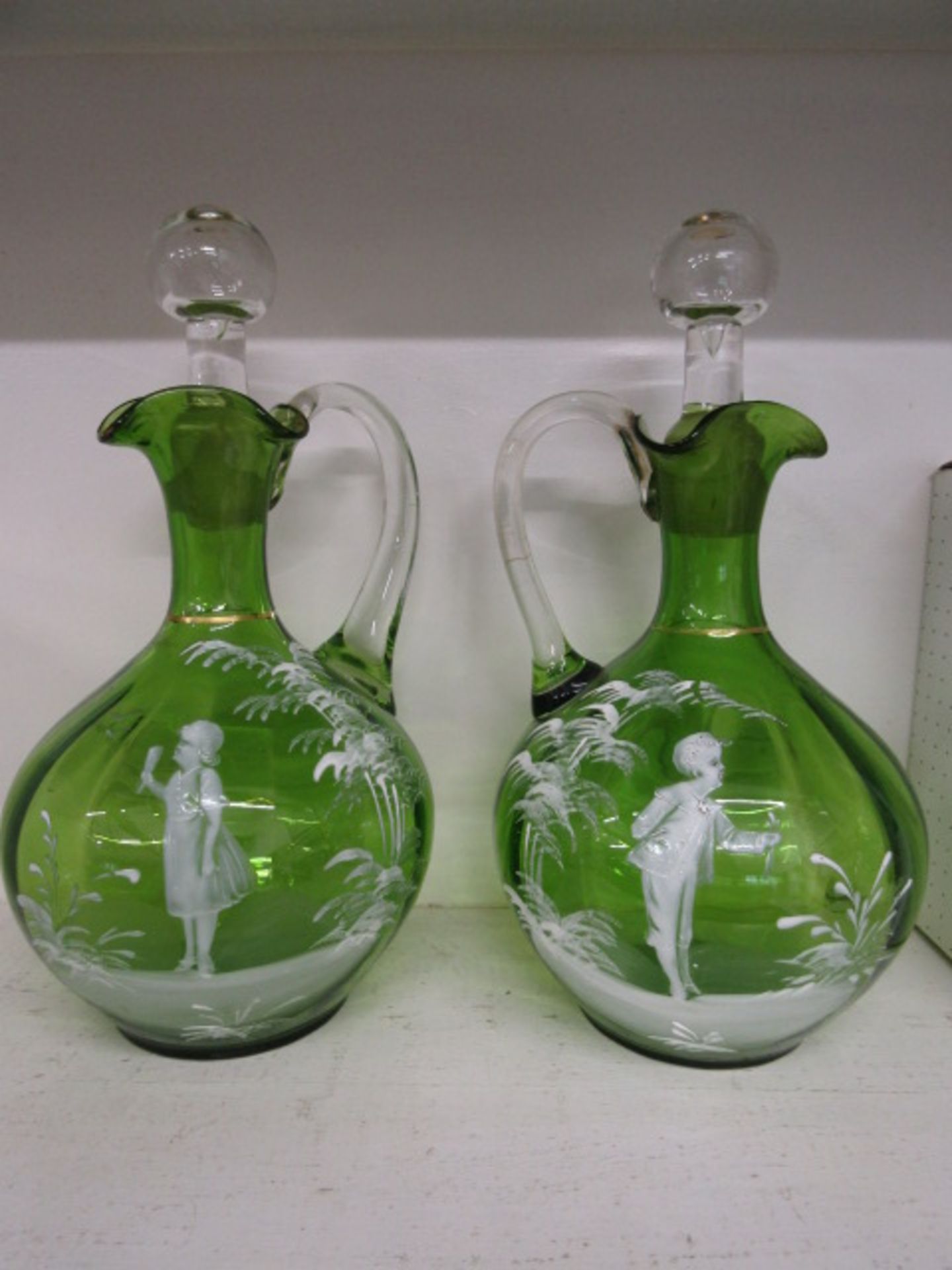 Pair green Mary Gregory decanters 20cmH one has hairline crack as pictured