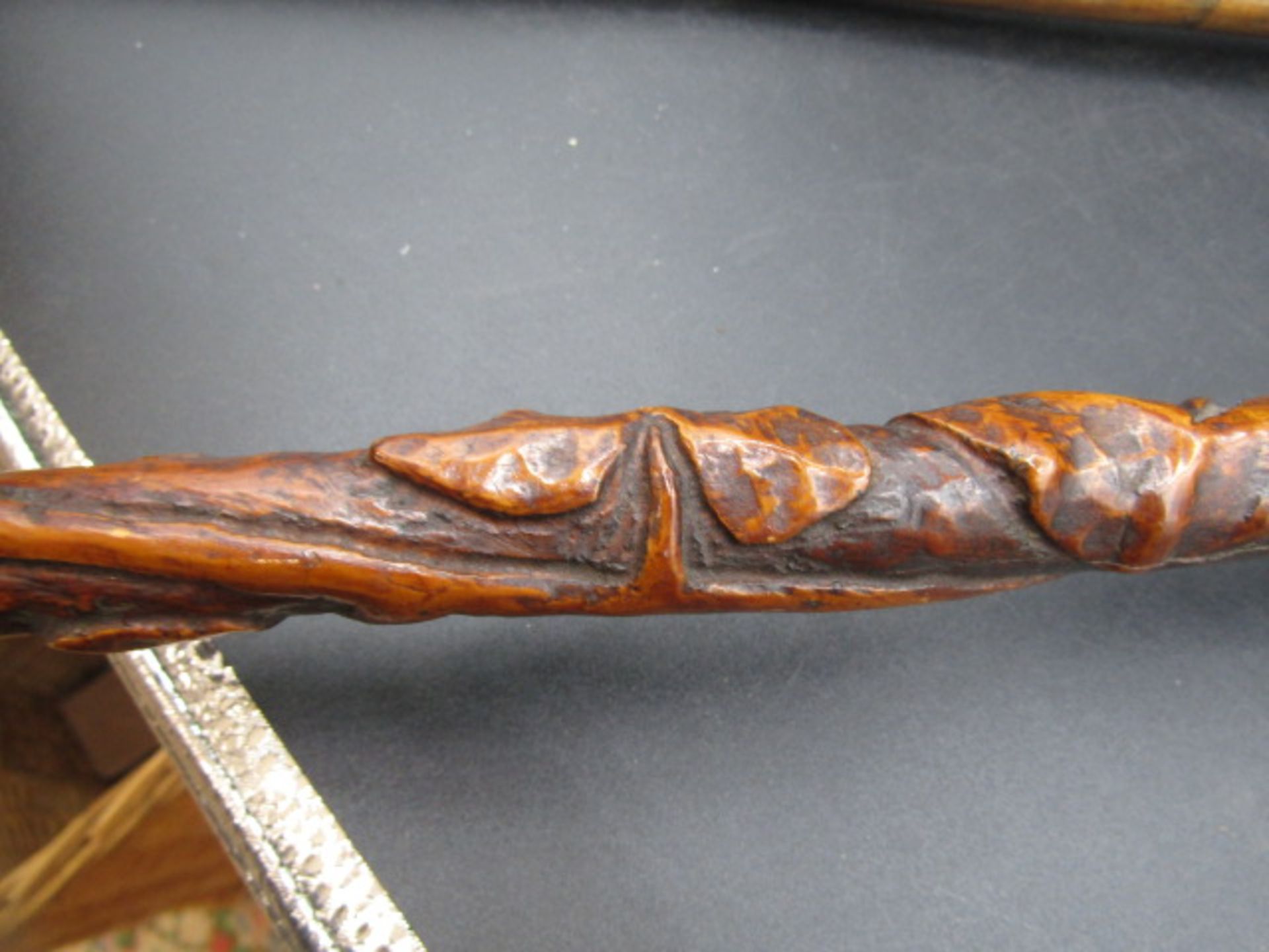 A carved walking cane with a hand clasping a ball with carved ivy down the cane plus a silver tipped - Image 6 of 7
