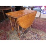 A light oak gate leg table with barley twist legs 104cmW x 54cm/154cm extended