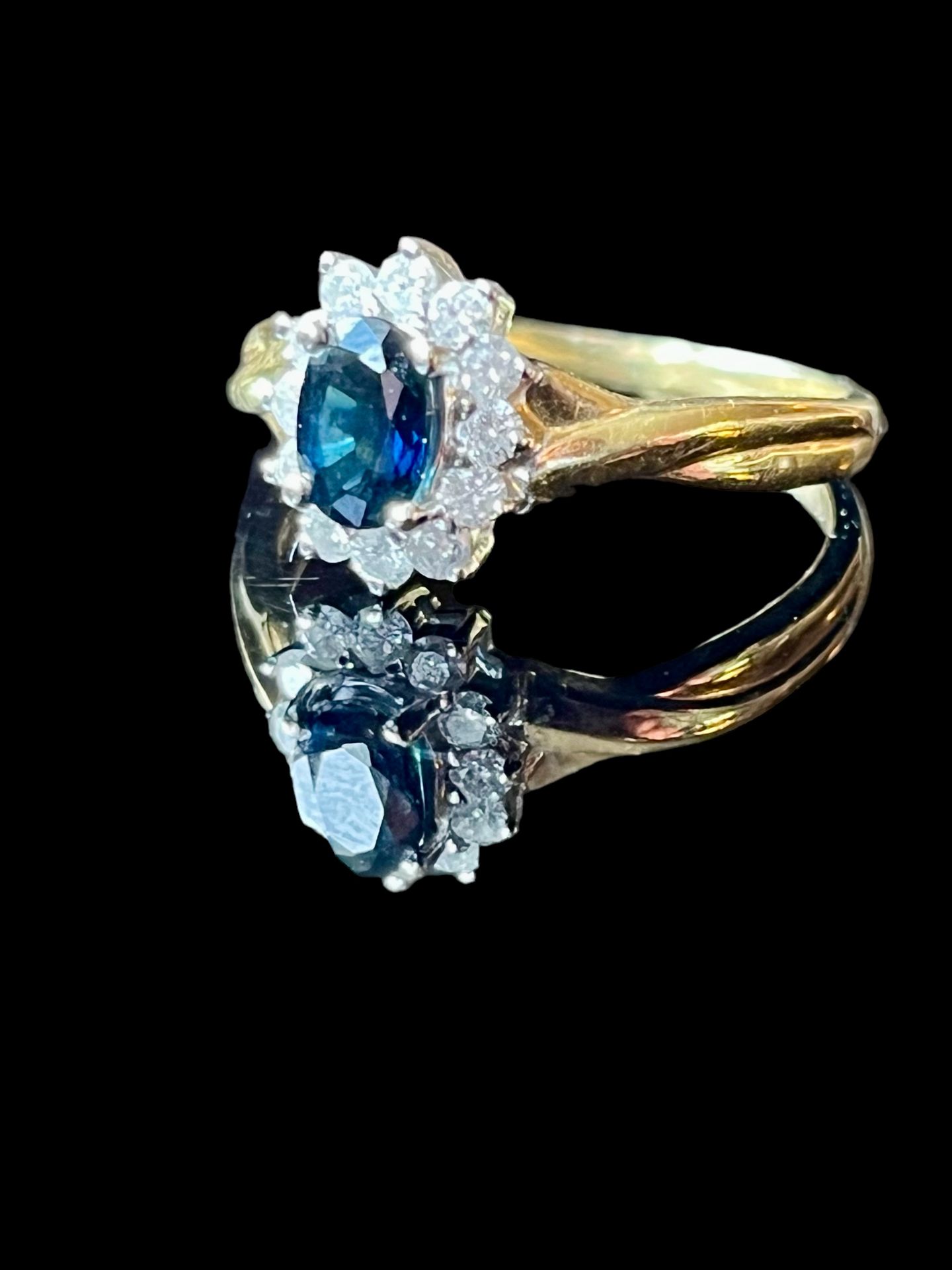 18ct gold, diamond and oval cut sapphire cluster ring, colour (G.I.A scale H) Clarity - Pi, carat