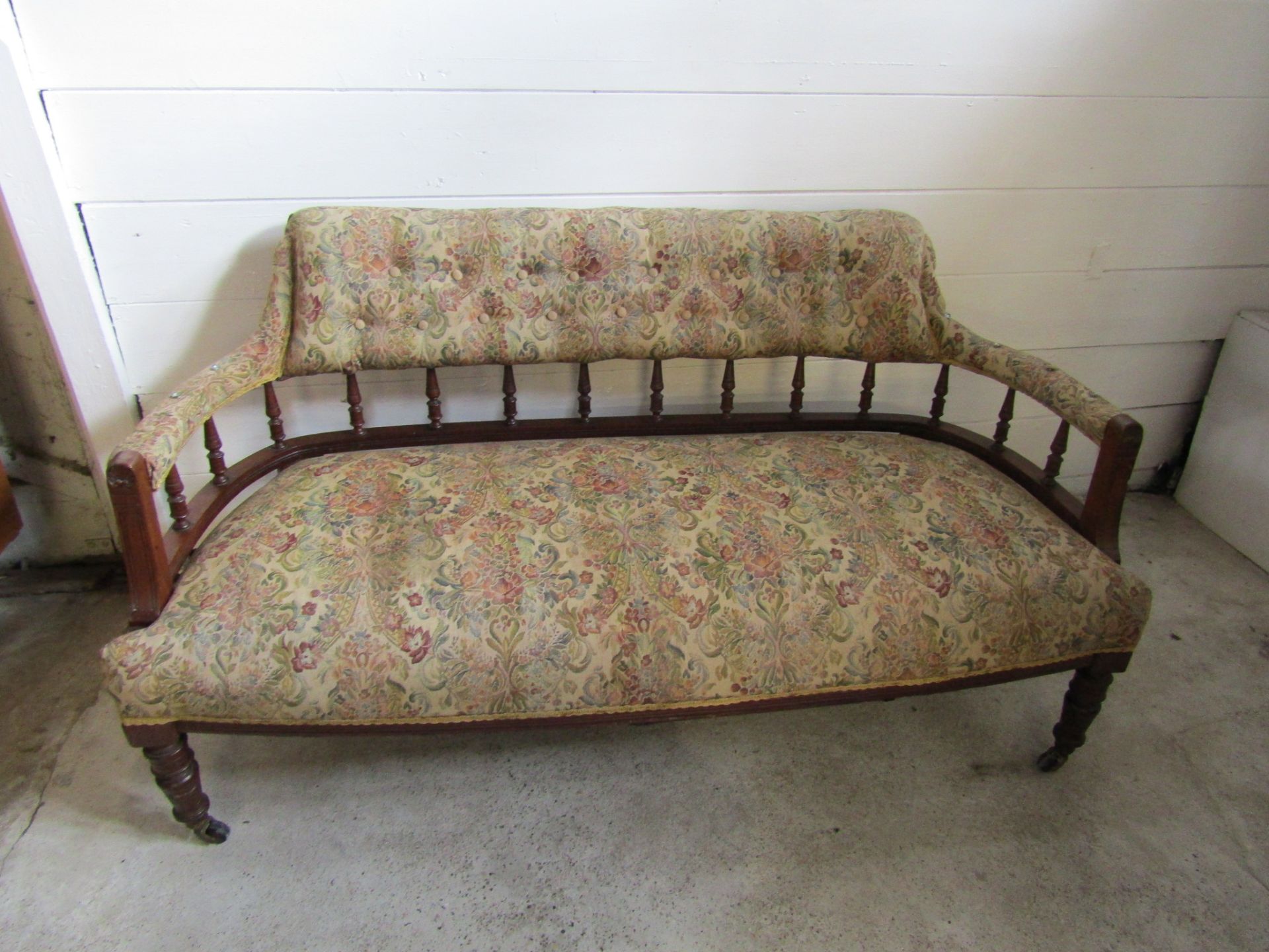 Upholstered mahogany sofa